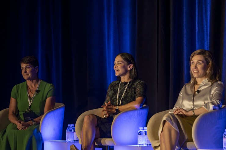 From left: Cathy Beardsley, president and CEO of Segpay; Carolyn Homberger, president of the Americas for Featurespace; and Katie Whalen, head of North America issuer processing for Fiserv. 